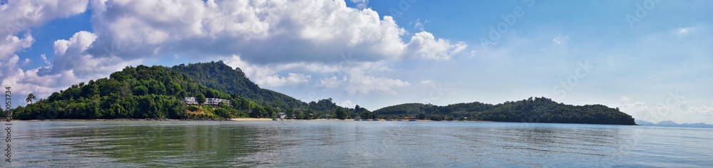 Island, Ocean views near Phuket Thailand with Blues, Turquoise and Greens oceans, mountains, boats, caves, trees resort island of phuket Thailand. Including Phi Phi, Ko Rang Yai, Ko Li Pe and other is