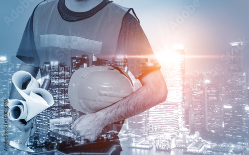 Future building construction engineering project concept with double exposure graphic design. Building engineer, architect people or construction worker working with modern civil equipment technology. photo