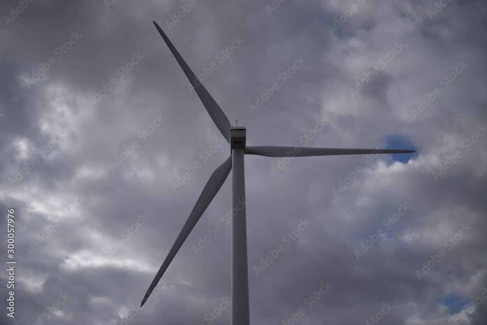 wind turbine against cloudy sky wind turbine against cloudy sky