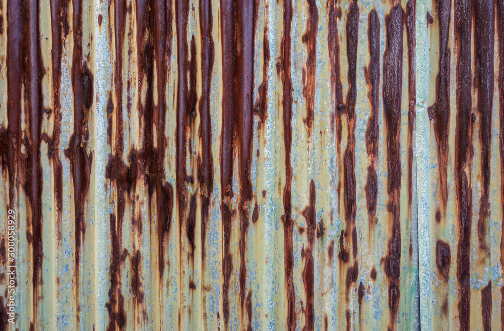 Rusty corrugated metal wall.
