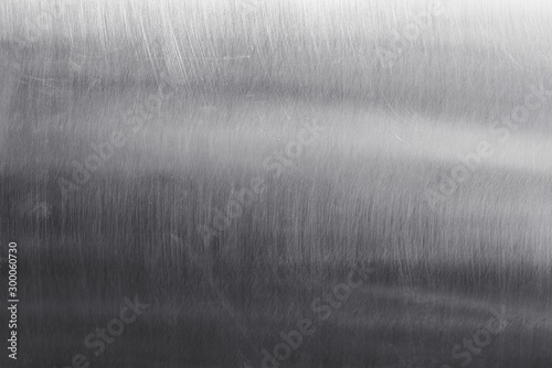 Stainless steel metal surface background or aluminum brushed silver texture with reflection.