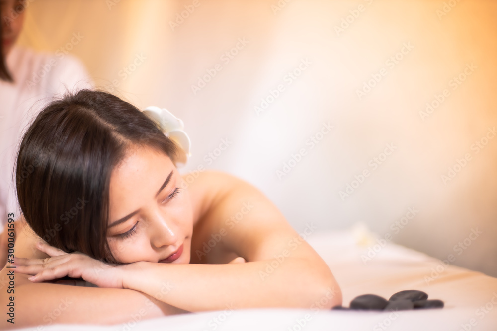 Asian Beautiful, young and healthy woman in spa salon. Massage treatment spa room . Traditional medicine and healing concept. Asian Beautiful, young and healthy woman in spa salon. Massage treatment spa room . Traditional medicine and healing concept.
