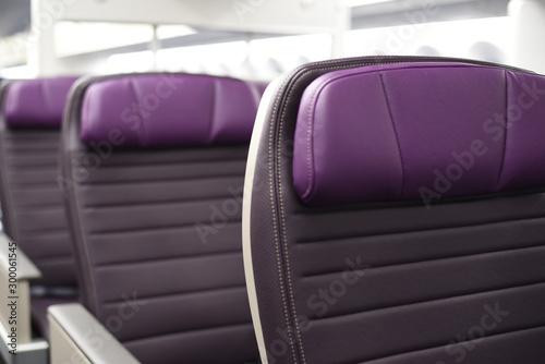 Rows of empty leather airplane seats