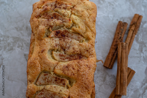 home made freshly baked pear cinnamon cake on a table photo