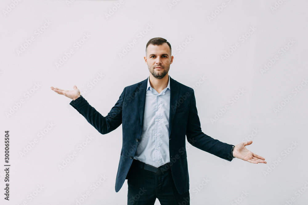 Emotions, smiles and choice of options. Business portrait of a young man. Emotions, smiles and choice of options. Business portrait of a young man.