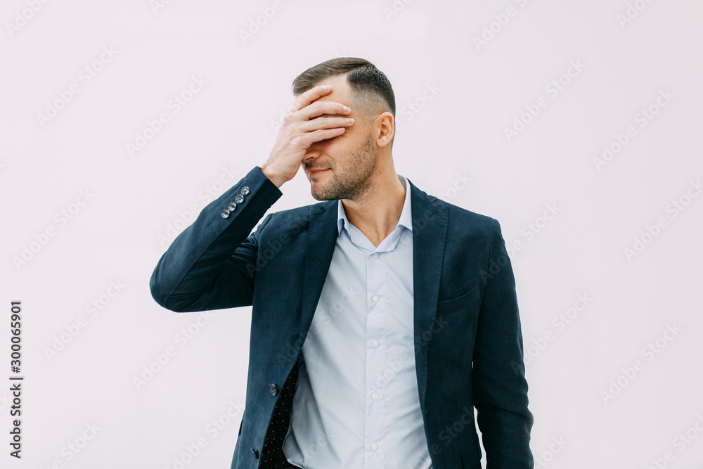 Failure and failure in the office, headache and anxiety. Portrait of a businessman with bad emotions. Failure and failure in the office, headache and anxiety. Portrait of a businessman with bad emotions.