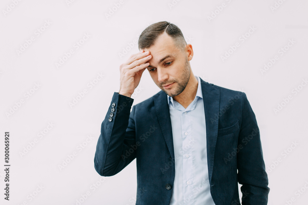 Failure and failure in the office, headache and anxiety. Portrait of a businessman with bad emotions. Failure and failure in the office, headache and anxiety. Portrait of a businessman with bad emotions.