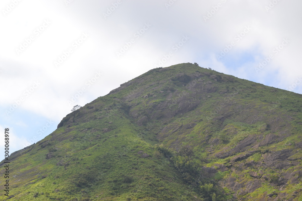 Naklejka premium landscape with mountains and clouds