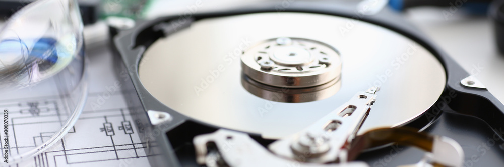 Hard drive from computer or laptop lies on the table Hard drive from computer or laptop lies on the table