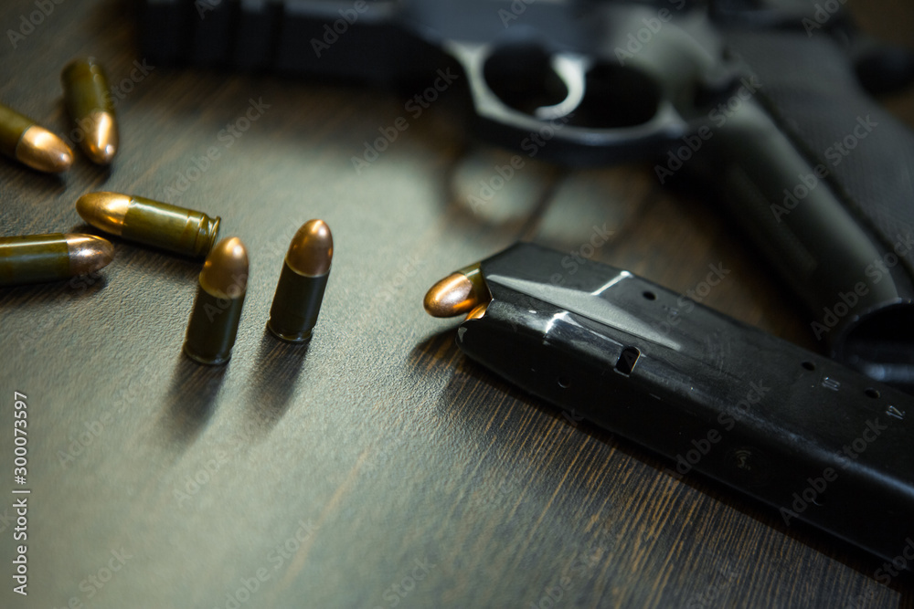 Close-up of a 9mm pistol and ammunition Close-up of a 9mm pistol and ammunition
