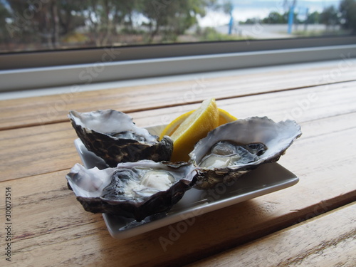 Lemon served with fresh oysters, Bruny Island, Tasmania, Australia photo