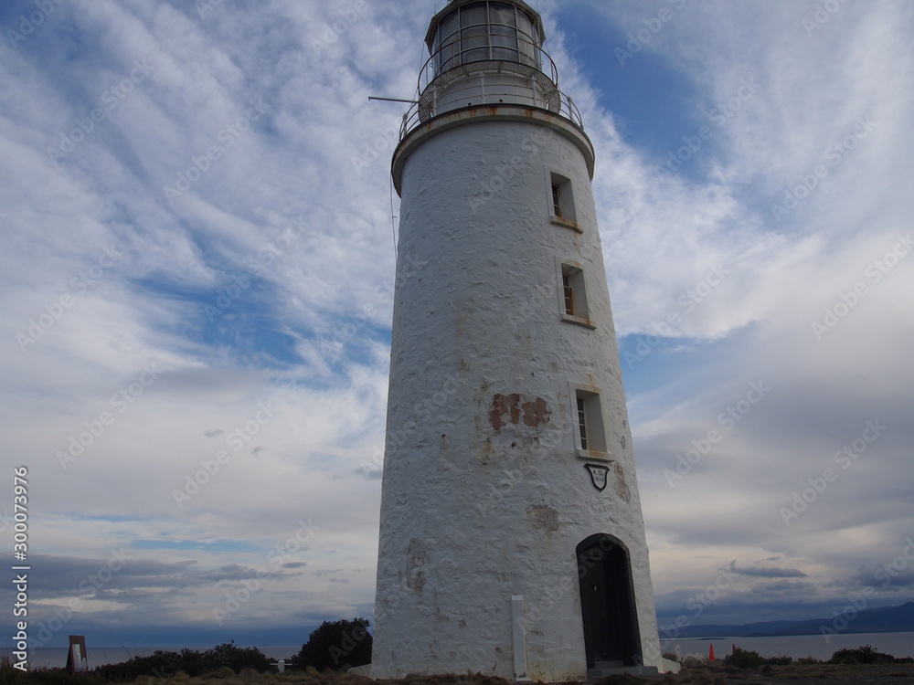 White lighthouse standing on a hill on the island, Bruny Island, Tasmania, Australia