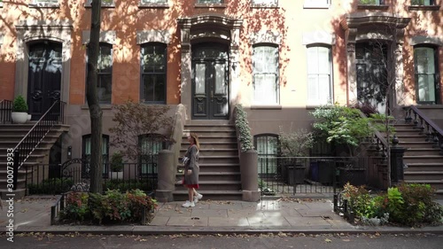 Young girl walking in a New York city midtown, soho district