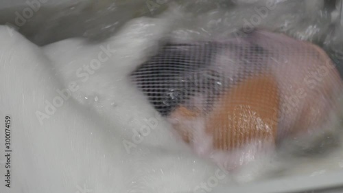 Top view of a washing machine drum during spinning clothes