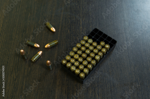 pistol cartridges 9 mm closeup okoto pistol, dark background