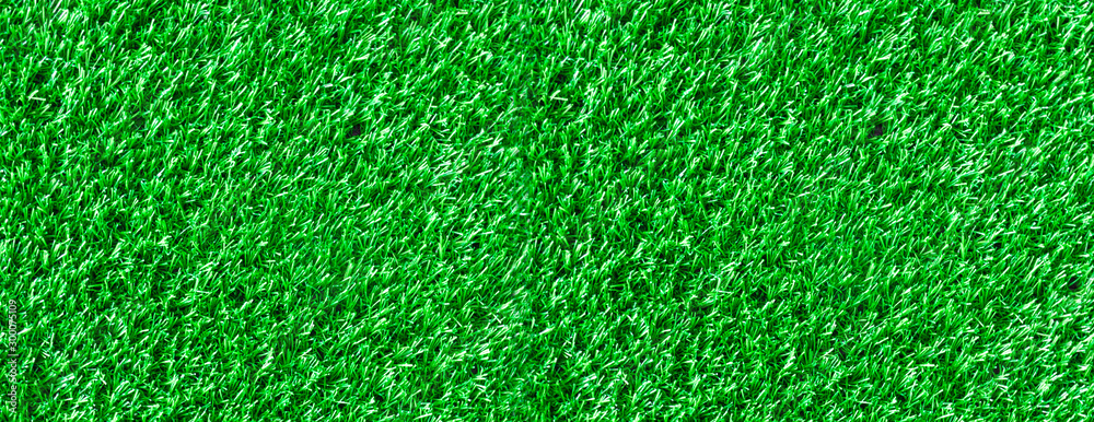 textural grassy green background made from grass of a football field. textural grassy green background made from grass of a football field.