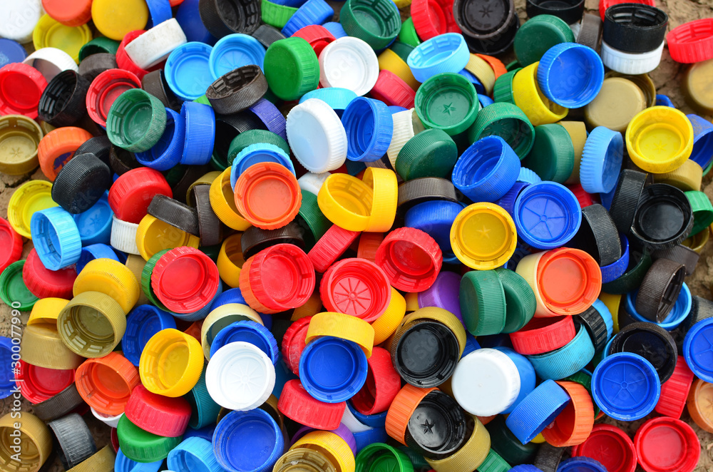 Plastic bottle caps background. Cap material is recyclable.Remove lids