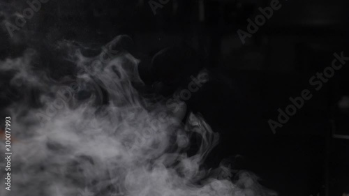Fire Smoke from Bottom Up on Black Background. White vapor rising up. Dense smoke while cooking. Slow motion. hd