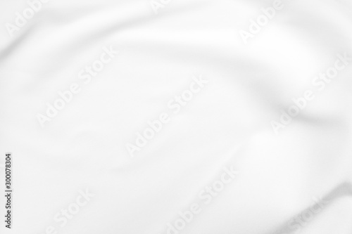 Abstract white fabric texture background. Cloth soft wave. Creases of satin, silk, and cotton.