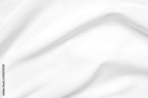 Abstract white fabric texture background. Cloth soft wave. Creases of satin, silk, and cotton.