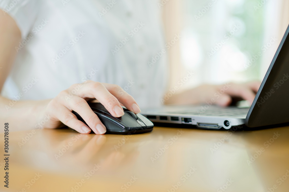 Image of female hands clicking computer mouse Image of female hands clicking computer mouse