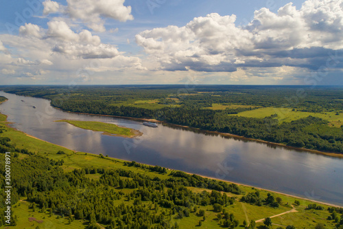 Over the Volga river on a sunny July day (aerial photography). Yaroslavl region, Russia
