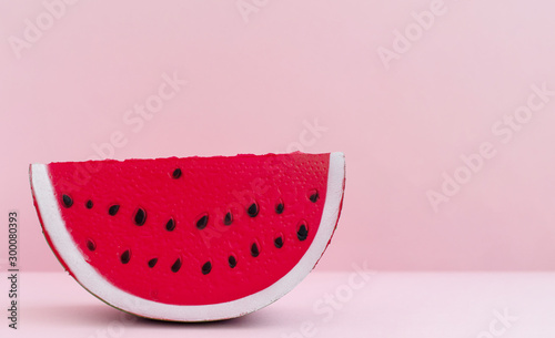anti stress squishy toy on pink background. squish in the form of watermelon slices. 