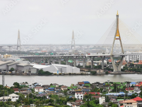 Bhumibol Bridge with river  cityscape view and cloudy sky in the morning.