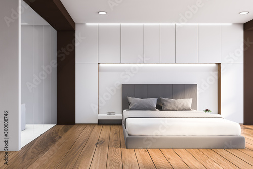 Front view of white and wood bedroom with bathroom