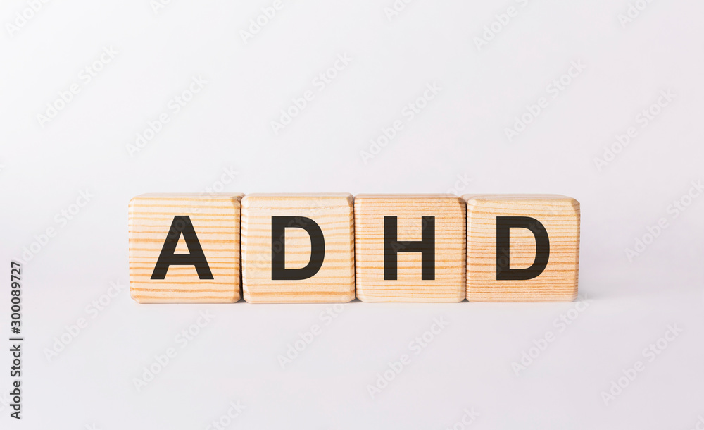 Word ADHD made from wooden blocks on white background Word ADHD made from wooden blocks on white background