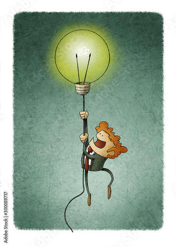 Businessman flying on a light bulb as a symbol of creativity.