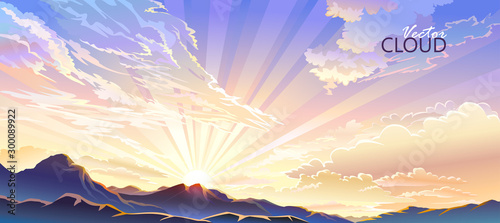 The sun setting behind the mountains and emitting radiant rays of light.