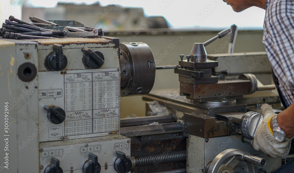 People are working with turning machines. People are working with turning machines.