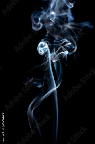 Colorful smoke on dark background.