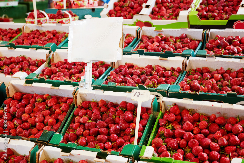 Fresh strawberries in boxes at the market