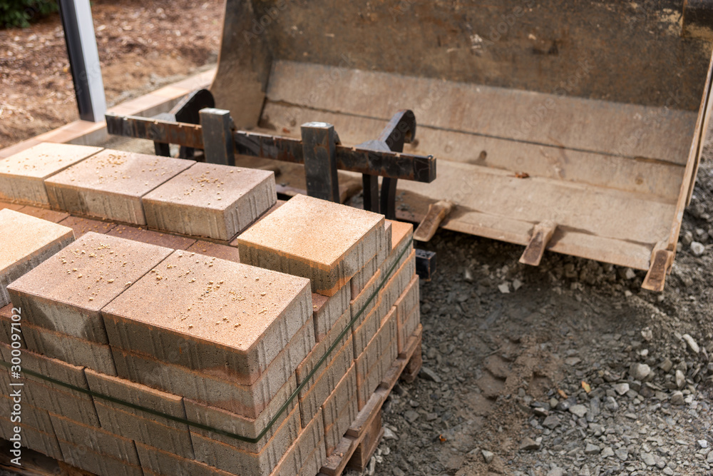 New paving slab on pallet, building materials for the reconstruction of the pavement New paving slab on pallet, building materials for the reconstruction of the pavement
