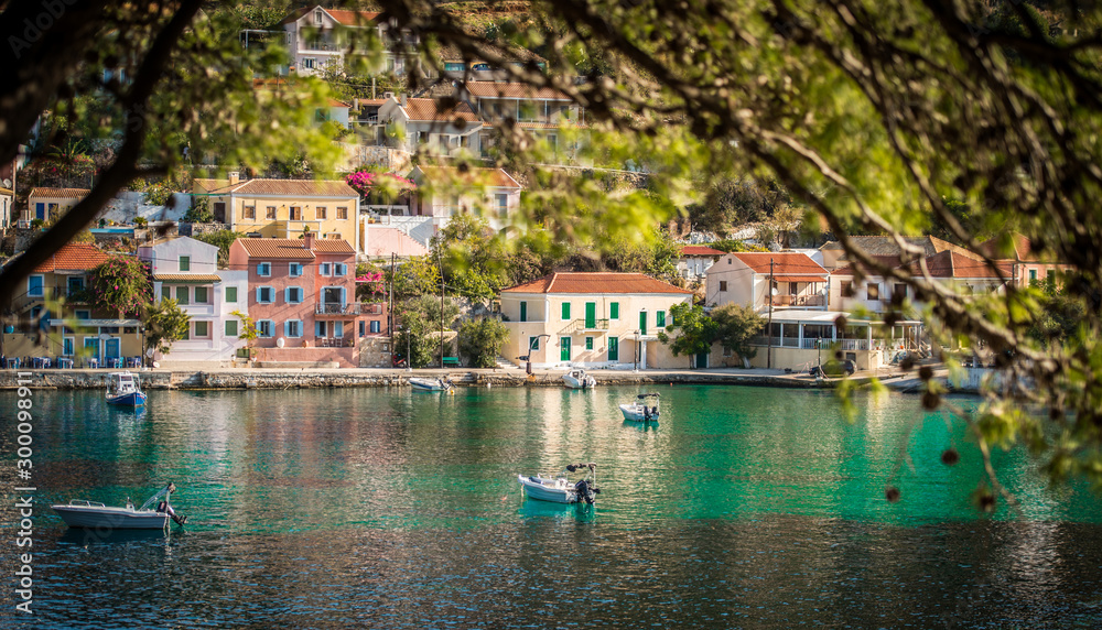 Obraz premium Beautiful landscape with bay and colorful buildings on the background in the town of Asos , Greece, Kefalonia. Wonderful exciting places. Panorama. Amazing Greece - picturesque colorful village