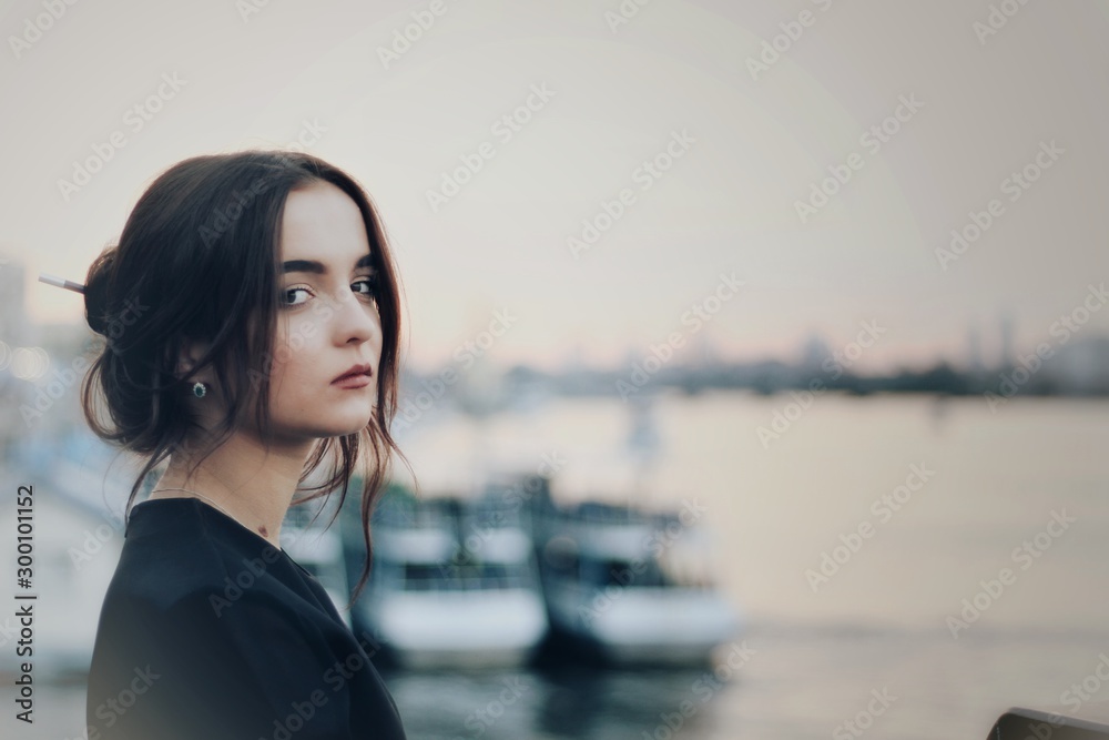 Young pretty girl walking down the street, retro portrait