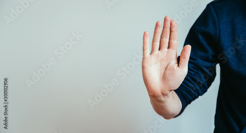 Defense or stop gesture: Male hand with stop gesture