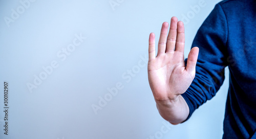 Defense or stop gesture: Male hand with stop gesture