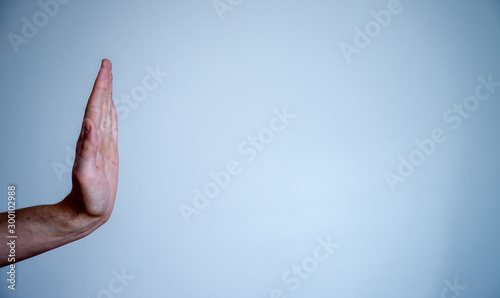 Defense or stop gesture: Male hand with stop gesture