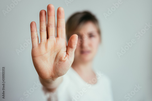 Defense or stop gesture: Girl hand with stop gesture