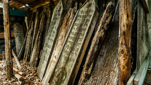 Old jewish cemetery in Lenino, Belarus. Unique Wooden Jewish matzevah. photo