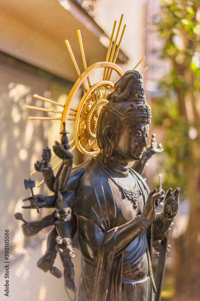 Fototapeta premium Bronze statue in the Togakuji temple of Tokyo depicting Japanese bodhisattva Jundei Kannon Bosatsu which is Goddess of Mercy.