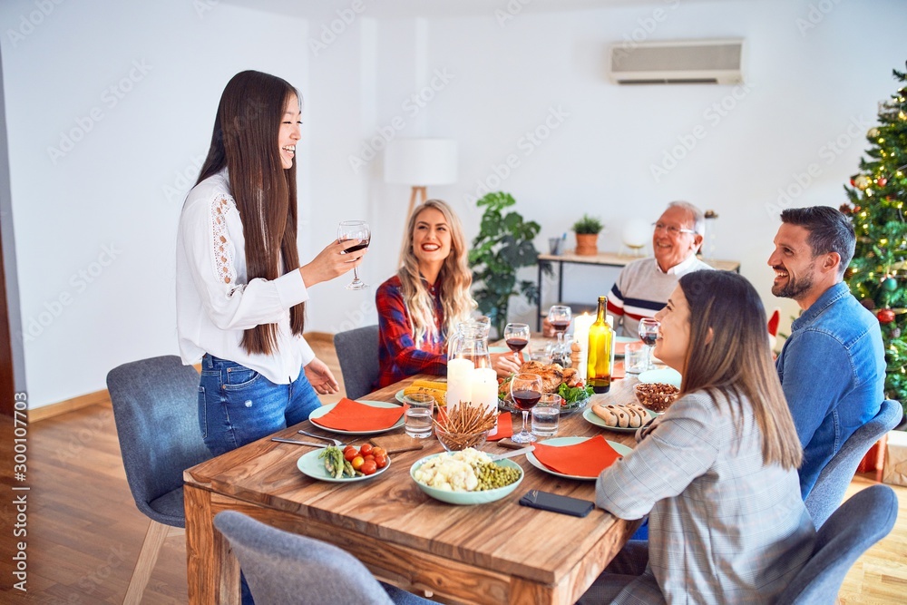 Beautiful family meeting smiling happy and confident. Speaking speech eating roasted turkey celebrating Christmas at home Beautiful family meeting smiling happy and confident. Speaking speech eating roasted turkey celebrating Christmas at home
