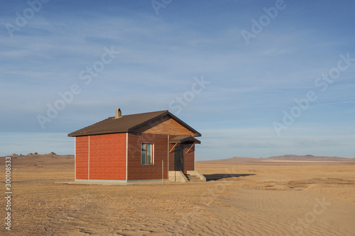 Minimal house in a desert photo