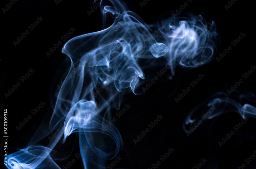 Fototapeta premium White smoke cigaret black dark background flash
