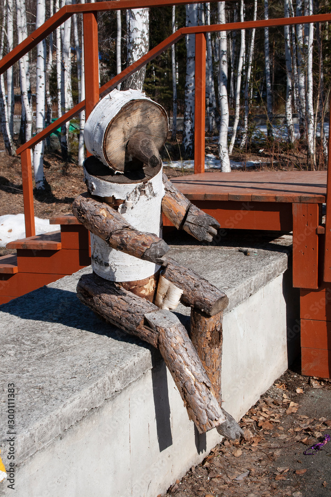 The bear is made out of wood, without