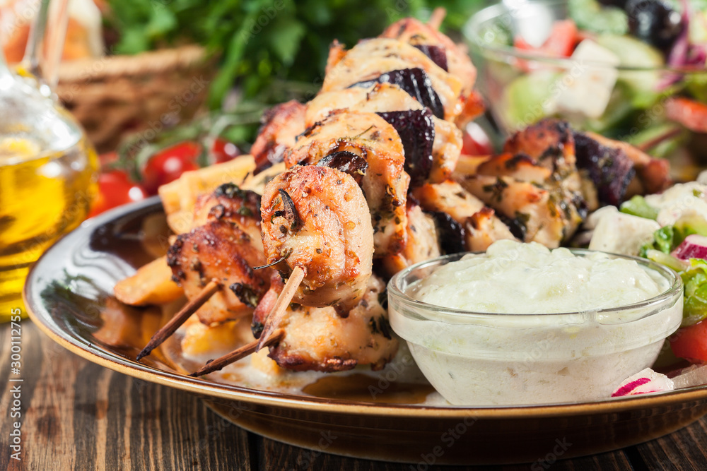 Chicken Souvlaki with french fries and tzatziki sauce Chicken Souvlaki with french fries and tzatziki sauce