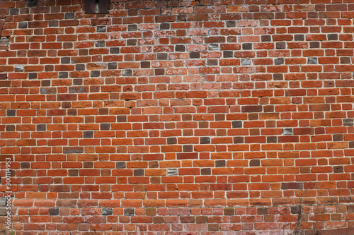red brick wall of the old house